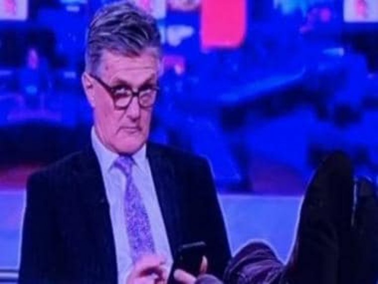 Watch: BBC presenter caught scrolling on phone with feet up during live broadcast