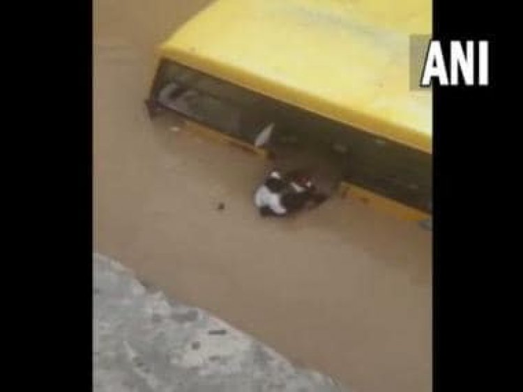 Watch: Locals rescue 30 students from school bus partially submerged in flooded street in Telangana