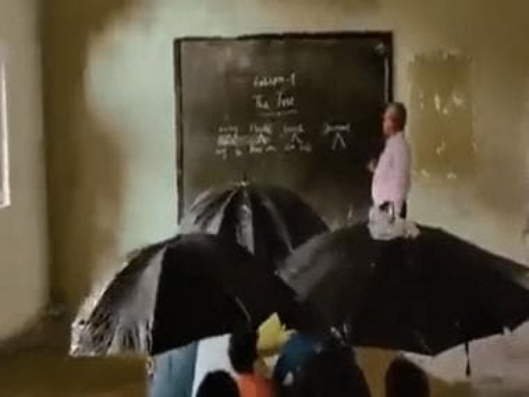Watch: School students in MP hold umbrellas inside classroom as roof leaks, video goes viral