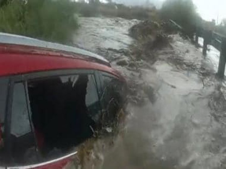 Watch: Arizona police rescues woman trapped inside car stuck in flood waters