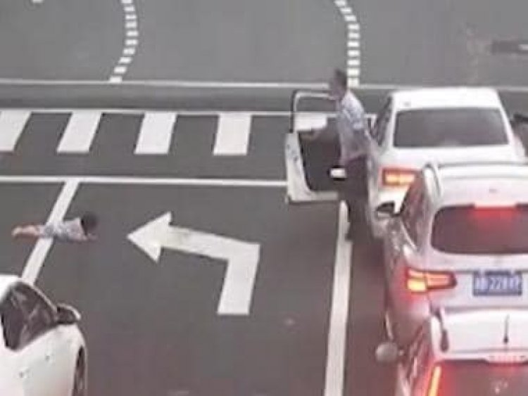 Watch: Child falls out of car's window on busy road in China, motorists rush to rescue