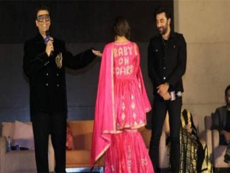 Alia Bhatt flaunts her customised 'Baby on board' ensemble as Ranbir Kapoor smiles at Brahmastra's grand event