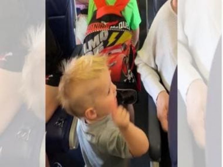 Video of 22-month-old toddler saying 'hi' to every passenger will win your heart