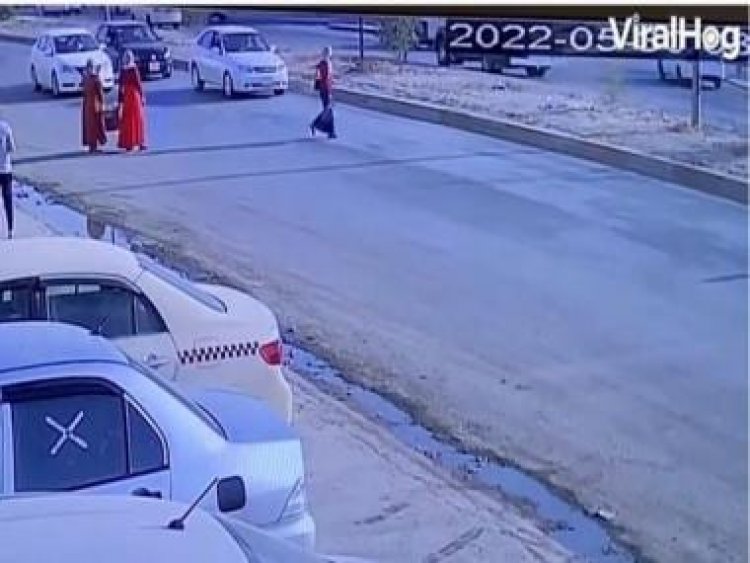 Careless woman miraculously escapes getting hit by car; watch