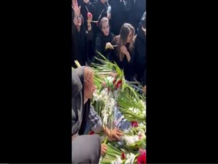 Watch: Woman chops hair at brother's funeral who was killed in Iran protests