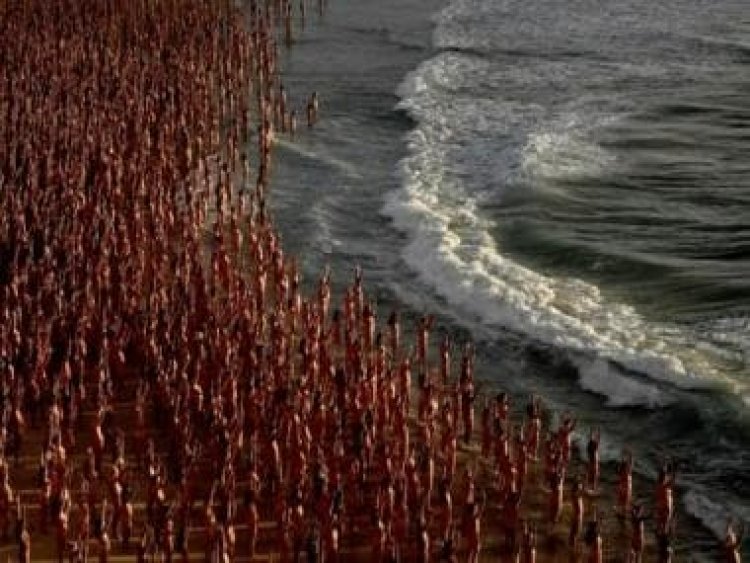 Australia: Bondi beach goes nude for one day as thousands strip off for Tunick's Sydney installation
