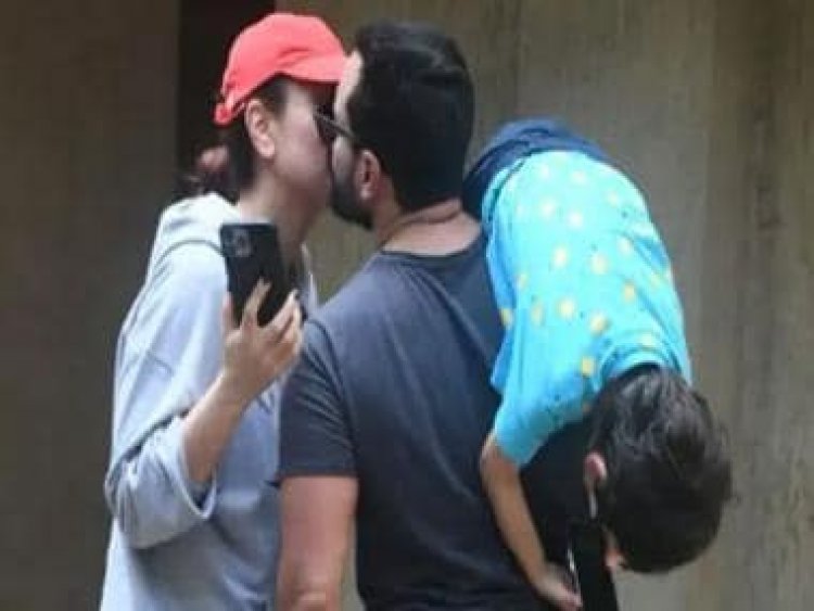 Watch: Kareena Kapoor, Saif Ali Khan share a kiss as Taimur hangs upside down from dad's shoulder