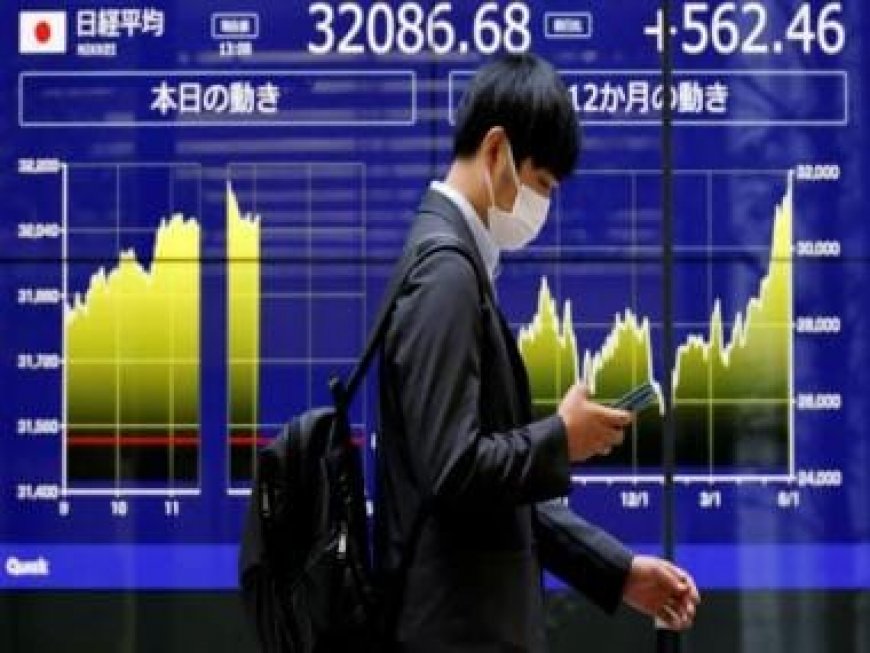 Asian stock markets extend global rally, oil prices rise after Saudi Arabia pledged output cuts