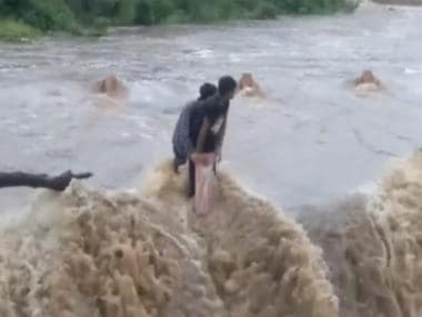 WATCH: Two youths rescued with hydraulic crane from flooded bridge in Udaipur's Morwaniya
