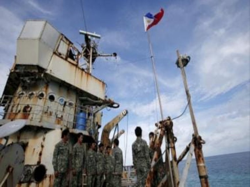 China slams Philippines over re-supply mission for troops on disputed atoll