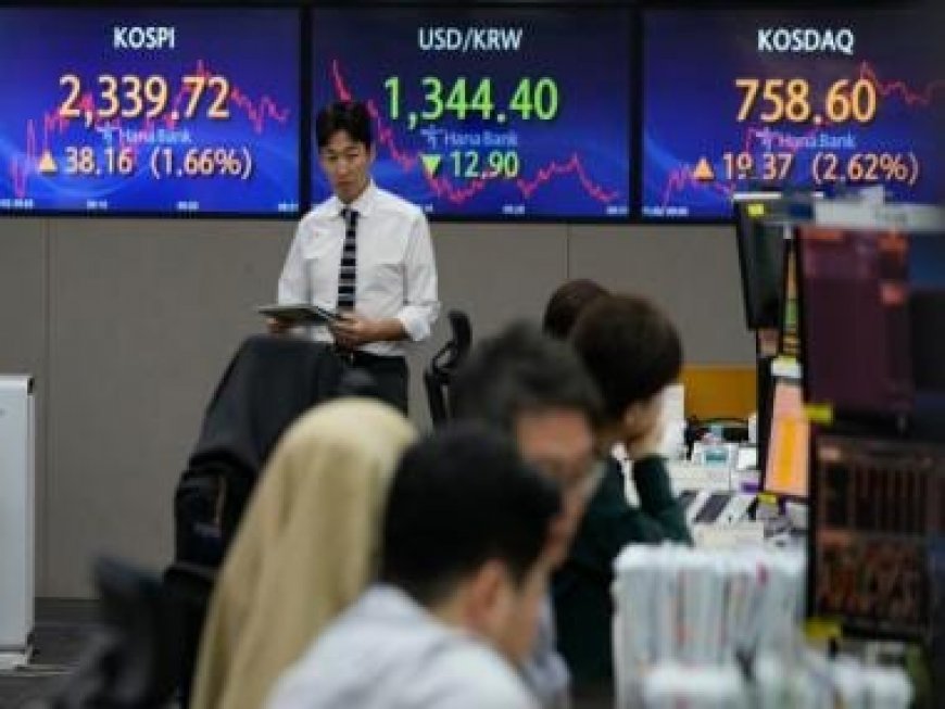 Asian markets track another Wall Street record on rate hopes