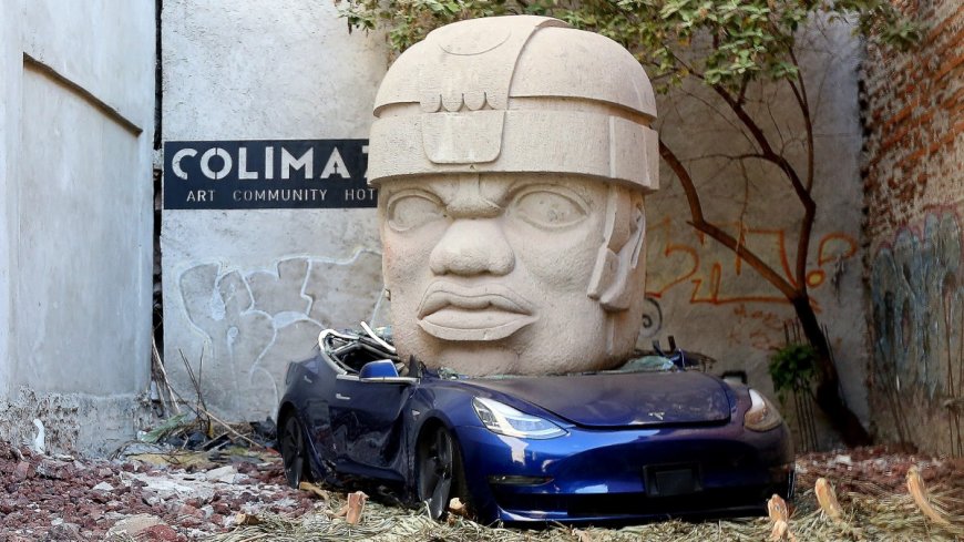Tesla crushed by giant head — why this artist is trolling Elon Musk